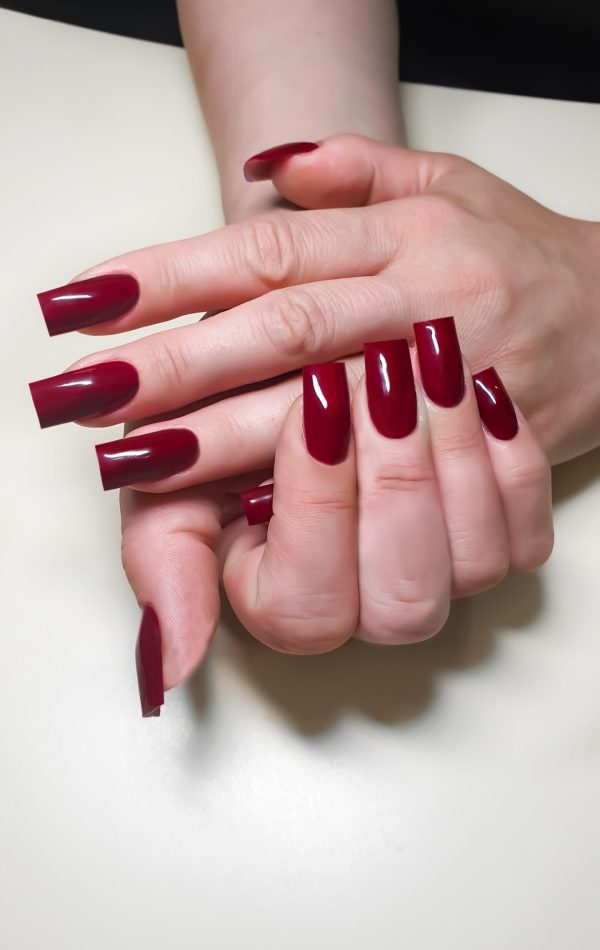 Acrylic nail extension, manicure, nail correction, hands in the foreground. Bright design. copy space